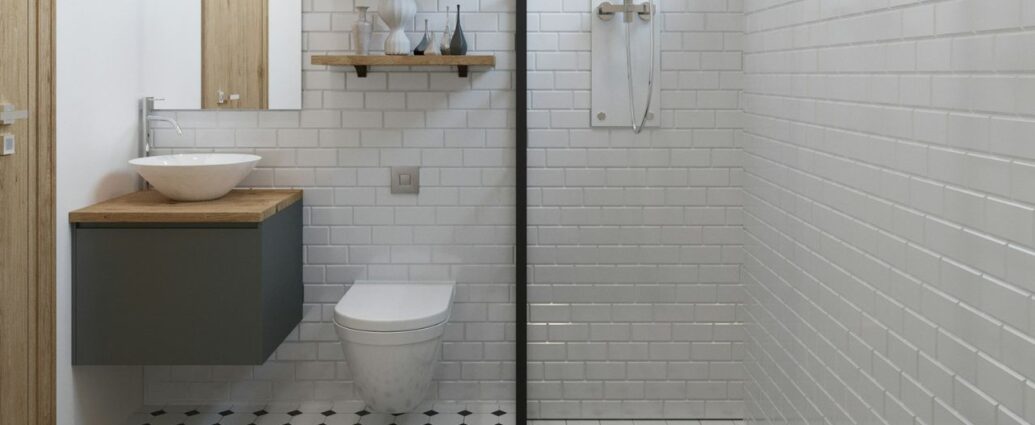 Biała łazienka z płytkami w formie cegiełek